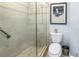 Bathroom with a toilet, shower, and grab bar at 340 Pinellas Bayway S # 306, St Petersburg, FL 33715