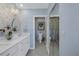 Elegant bathroom with a double vanity and a large walk-in shower at 340 Pinellas Bayway S # 306, Tierra Verde, FL 33715