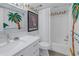 Bathroom with white vanity and tub/shower combo at 340 Pinellas Bayway S # 306, St Petersburg, FL 33715