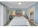 Bright bedroom with a queen-size bed and ensuite bathroom access at 340 Pinellas Bayway S # 306, St Petersburg, FL 33715