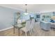 Bright dining area with glass table and four chairs at 340 Pinellas Bayway S # 306, St Petersburg, FL 33715