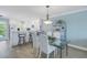 Open concept kitchen and dining area with breakfast bar at 340 Pinellas Bayway S # 306, St Petersburg, FL 33715