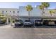 Covered parking with several cars parked under carport at 340 Pinellas Bayway S # 306, Tierra Verde, FL 33715