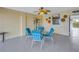 Covered patio with table and chairs, near pool at 340 Pinellas Bayway S # 306, St Petersburg, FL 33715