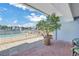 Brick patio with pool and water views at 340 Pinellas Bayway S # 306, Tierra Verde, FL 33715