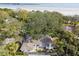 Aerial view of house near the waterfront, surrounded by trees at 356 Grand Central Ave, Safety Harbor, FL 34695