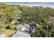 Aerial view of a single-Gathering home with a large backyard, situated near the waterfront at 356 Grand Central Ave, Safety Harbor, FL 34695