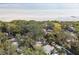 Aerial view showcasing a home's location near the water and lush surroundings at 356 Grand Central Ave, Safety Harbor, FL 34695