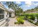 Landscaped backyard with a patio and a Buddha statue at 356 Grand Central Ave, Safety Harbor, FL 34695