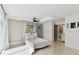 Bedroom with a white bed and access to a backyard at 356 Grand Central Ave, Safety Harbor, FL 34695