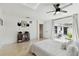 Bright bedroom with white bedding and sliding glass door leading to a patio at 356 Grand Central Ave, Safety Harbor, FL 34695