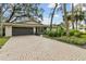 Home with a large driveway and mature landscaping at 356 Grand Central Ave, Safety Harbor, FL 34695