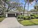 House exterior showcasing a brick driveway and lush landscaping at 356 Grand Central Ave, Safety Harbor, FL 34695