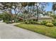 House exterior showcasing a well-maintained lawn and neighborhood view at 356 Grand Central Ave, Safety Harbor, FL 34695