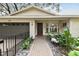 Landscaped front yard with brick pathway leading to the house entrance at 356 Grand Central Ave, Safety Harbor, FL 34695