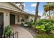 Landscaped front yard with a brick walkway and decorative plants at 356 Grand Central Ave, Safety Harbor, FL 34695