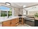 Modern kitchen with white countertops and a stone backsplash at 356 Grand Central Ave, Safety Harbor, FL 34695