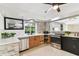 Updated kitchen, featuring stainless steel appliances and stone backsplash at 356 Grand Central Ave, Safety Harbor, FL 34695