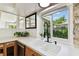 Modern kitchen features a white sink, black faucet, and wood cabinets at 356 Grand Central Ave, Safety Harbor, FL 34695