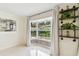 Living room featuring bay window and decorative shelving at 356 Grand Central Ave, Safety Harbor, FL 34695