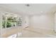 Living room with bay window, tile floor, and view to the front yard at 356 Grand Central Ave, Safety Harbor, FL 34695