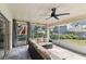 Relaxing screened porch with view of backyard and trees at 356 Grand Central Ave, Safety Harbor, FL 34695