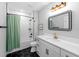 Modern bathroom with white vanity, hexagon floor tiles, and a subway tiled shower/tub at 37137 Florida Ave, Dade City, FL 33525