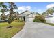 Two-car garage and well-manicured lawn. Charming craftsman style home at 37137 Florida Ave, Dade City, FL 33525