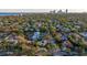 Aerial view showcasing a house's location in a residential neighborhood with city skyline in the distance at 400 22Nd Ne Ave, St Petersburg, FL 33704