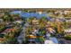 Aerial view showing a house with a pool, situated near a waterway in a residential area at 400 22Nd Ne Ave, St Petersburg, FL 33704