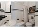 Classic black and white bathroom with tub and shower at 400 22Nd Ne Ave, St Petersburg, FL 33704