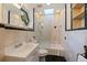 Bathroom features a shower/tub combo, skylight, and tiled floors at 400 22Nd Ne Ave, St Petersburg, FL 33704