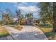 Charming mid-century home with a stone facade and a spacious driveway at 400 22Nd Ne Ave, St Petersburg, FL 33704