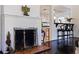 Elegant fireplace with brass screen and ornate andirons at 400 22Nd Ne Ave, St Petersburg, FL 33704