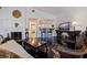 Living room featuring dark hardwood floors, a fireplace, and access to the kitchen at 400 22Nd Ne Ave, St Petersburg, FL 33704