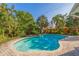 Large kidney shaped pool with brick pavers and tropical landscaping at 400 22Nd Ne Ave, St Petersburg, FL 33704