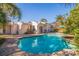 Inviting kidney-shaped pool surrounded by lush landscaping at 400 22Nd Ne Ave, St Petersburg, FL 33704