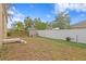 Small backyard with shed and white vinyl fence at 4008 W North B St, Tampa, FL 33609