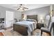 Spacious bedroom with a double bed, ceiling fan, and exterior access at 4008 W North B St, Tampa, FL 33609