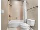 Simple bathroom with shower/tub combo and white toilet at 418 S Albany Ave, Tampa, FL 33606