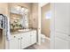 Guest Bathroom with toilet and granite vanity at 418 S Albany Ave, Tampa, FL 33606