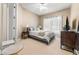 Cozy bedroom with a queen-size bed and window coverings at 418 S Albany Ave, Tampa, FL 33606