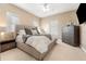 Main bedroom with a king-size bed, neutral color scheme, and ample natural light at 418 S Albany Ave, Tampa, FL 33606