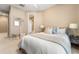 Bright bedroom with a queen-size bed and en-suite bathroom at 418 S Albany Ave, Tampa, FL 33606