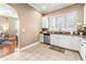 Well-lit kitchen with white cabinets, granite counters, and stainless steel appliances at 418 S Albany Ave, Tampa, FL 33606