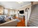 Living room featuring hardwood floors, comfortable seating, and a view of the dining area at 418 S Albany Ave, Tampa, FL 33606