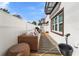 Outdoor patio space with wicker furniture and wood deck at 418 S Albany Ave, Tampa, FL 33606