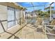 Back patio with seating area and sliding glass doors at 4308 Craftsbury Dr, New Port Richey, FL 34652