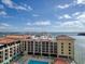 Condo building with pool and surrounding cityscape view at 450 Gulfview S Blvd # 1708, Clearwater, FL 33767