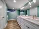 Modern bathroom with double vanity and light wood floors at 450 Gulfview S Blvd # 1708, Clearwater, FL 33767